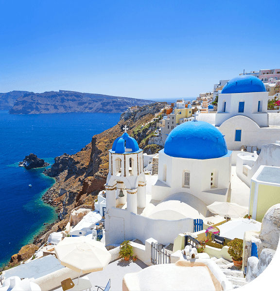 Blue dome cliff houses, Santorini, Greece.