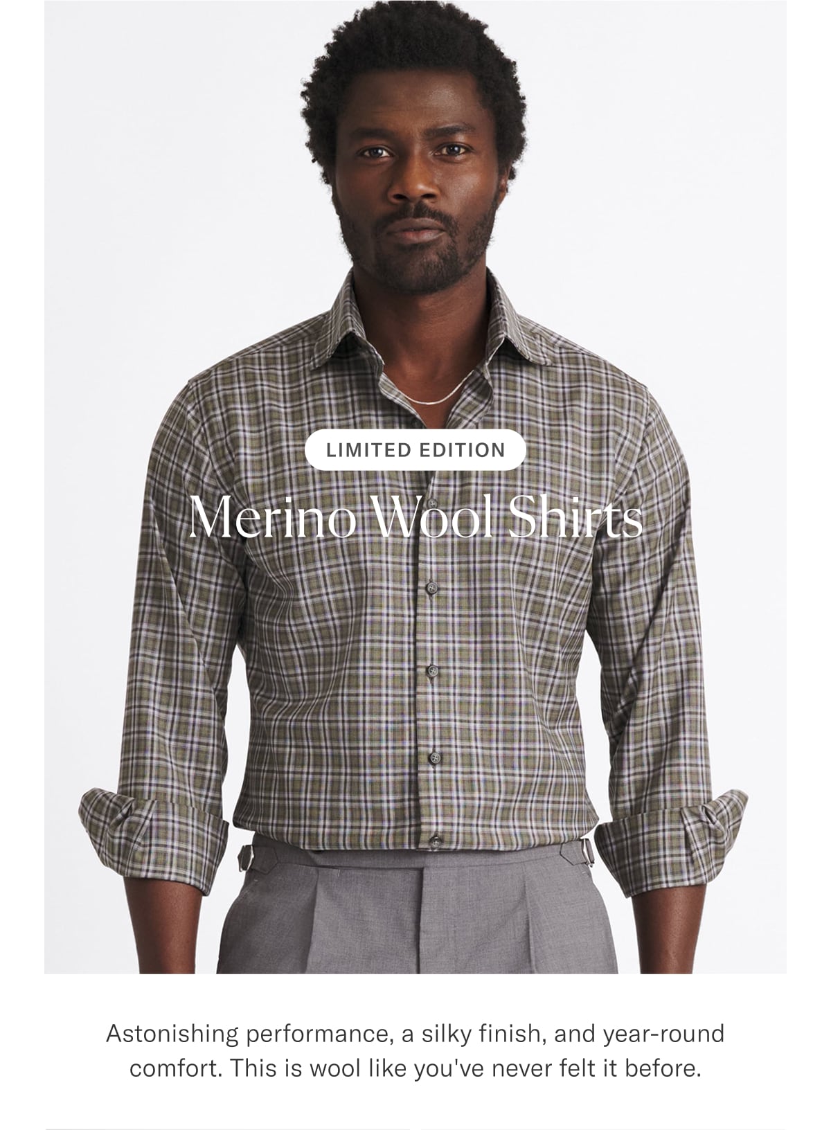 an image of a man in a plaid shirt and slacks