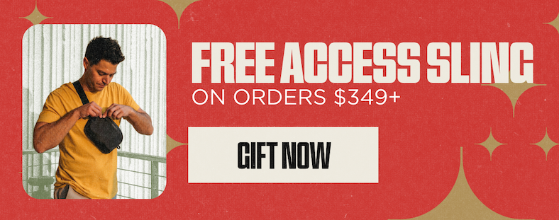 Nomatic Holiday Sale graphic with red background and gold starburst accents