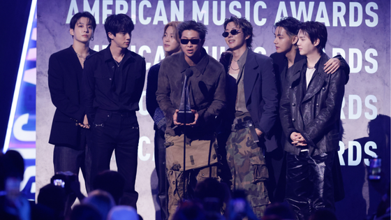 BTS assemble onstage.