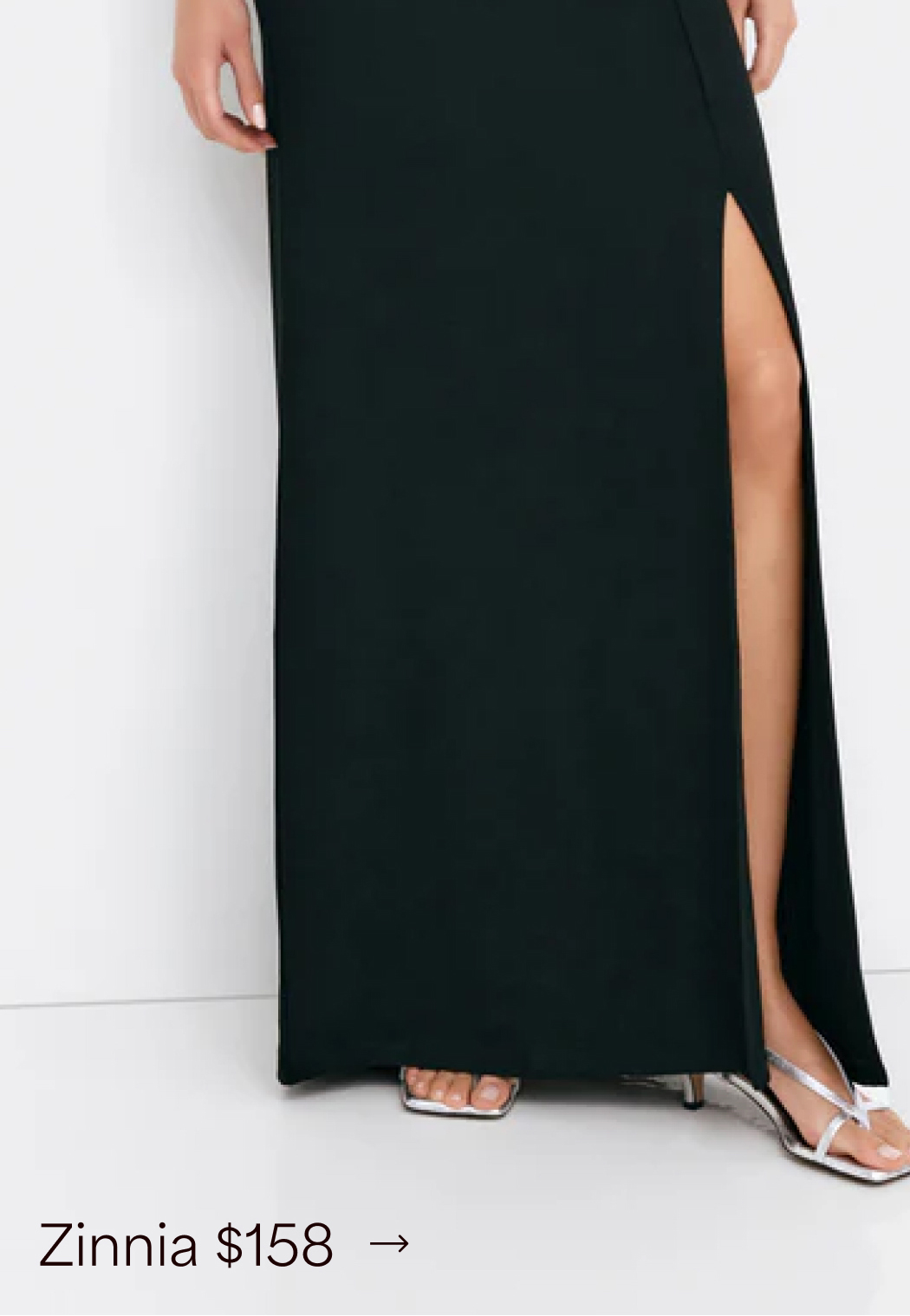 Astrid wears The Zinnia Dress with a sheer mesh sleeve.