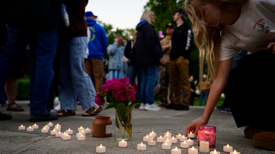 Mourners light candles.