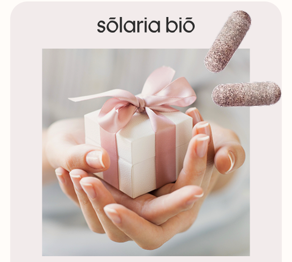 Hands holding a beautifully wrapped gift