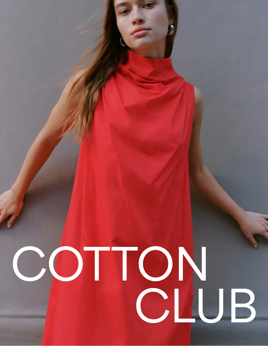 Bianca in the Minna Sleeveless Dress stands against a gray wall beside the text "Cotton Club."