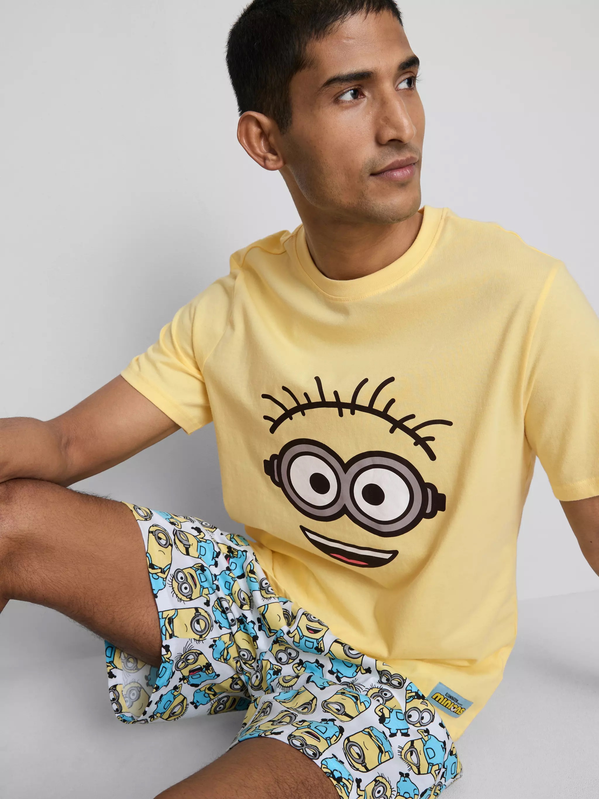 Man wearing a Men's Minions Family Matching Pajama Set