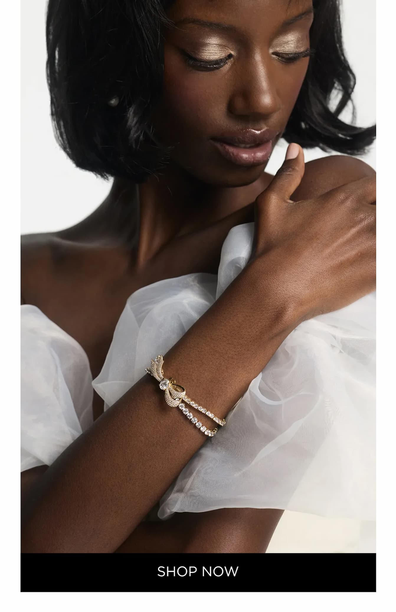 image of model wearing bridal gown and EROS BOW TENNIS BRACELET