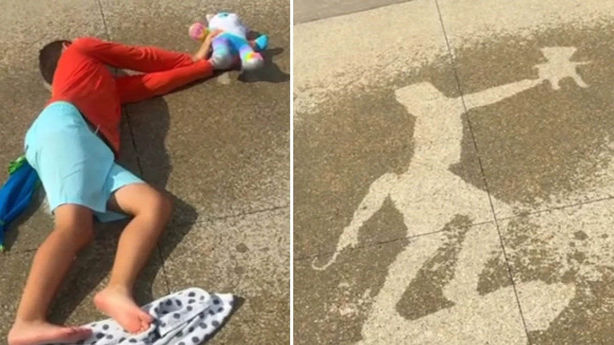A child lays on the ground.