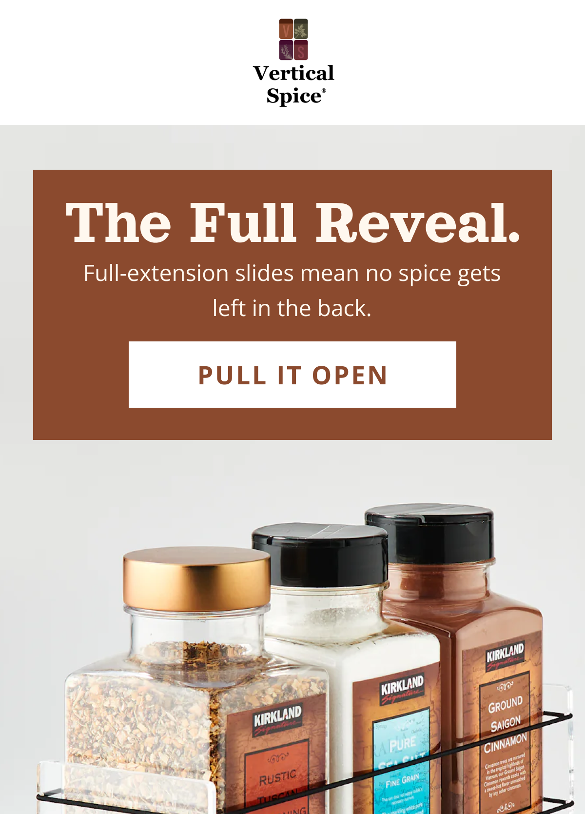 Modern pull-out spice rack drawer with full-extension slides showing all spices clearly organized in a kitchen cabinet
