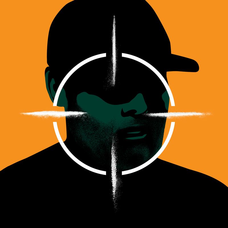 Man with a white target on him.