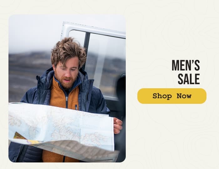 Photo of a man wearing Craghoppers jackets while checking a map. Men's sale. Shop Now.