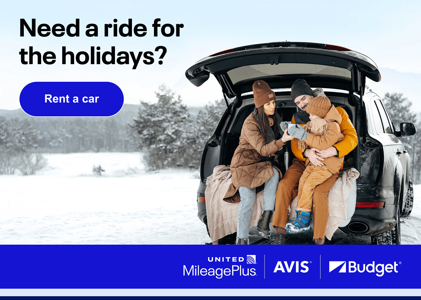 Family sitting in the back of a car
