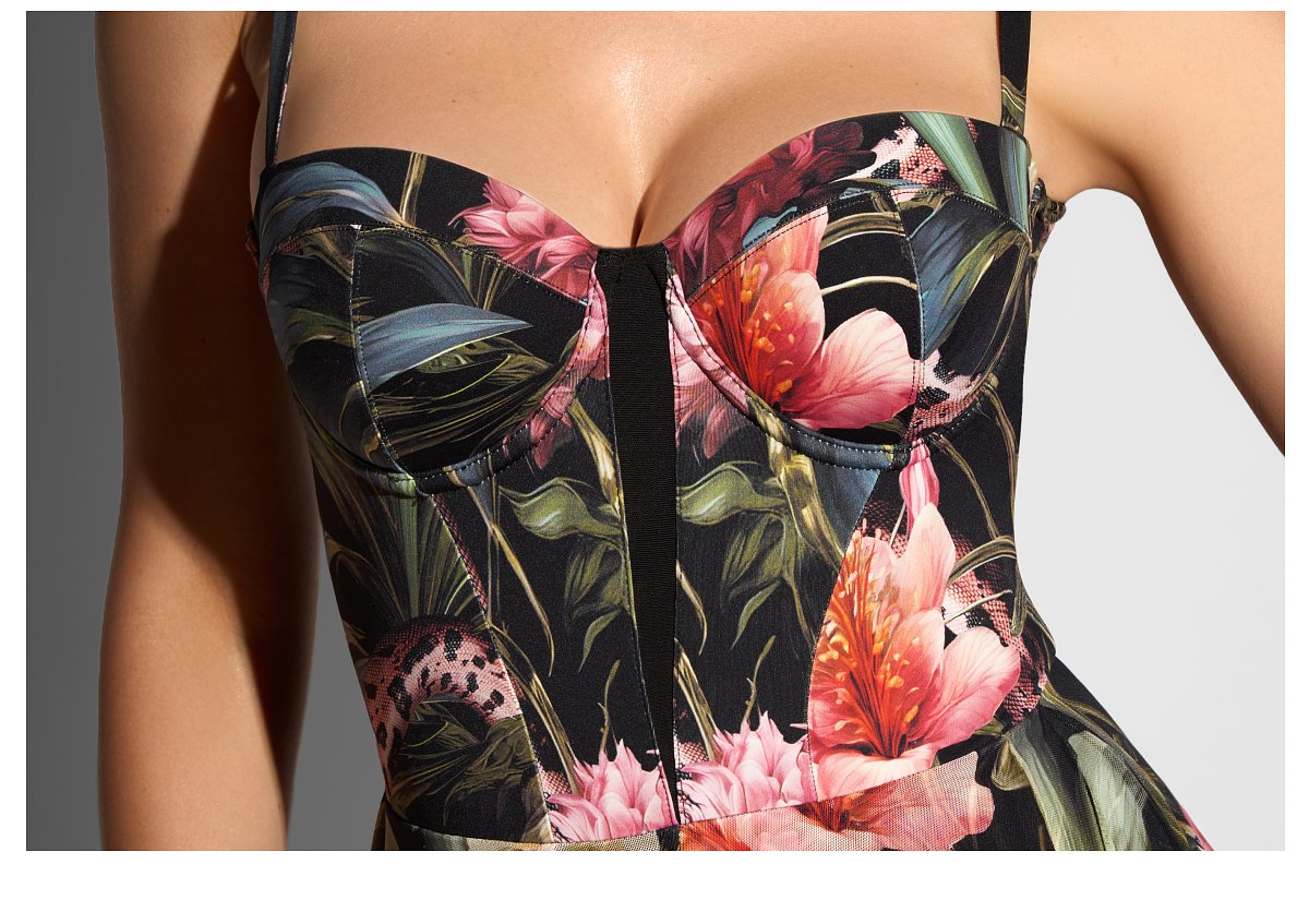 Floral print dress with a fitted bodice featuring large pink and orange flowers.