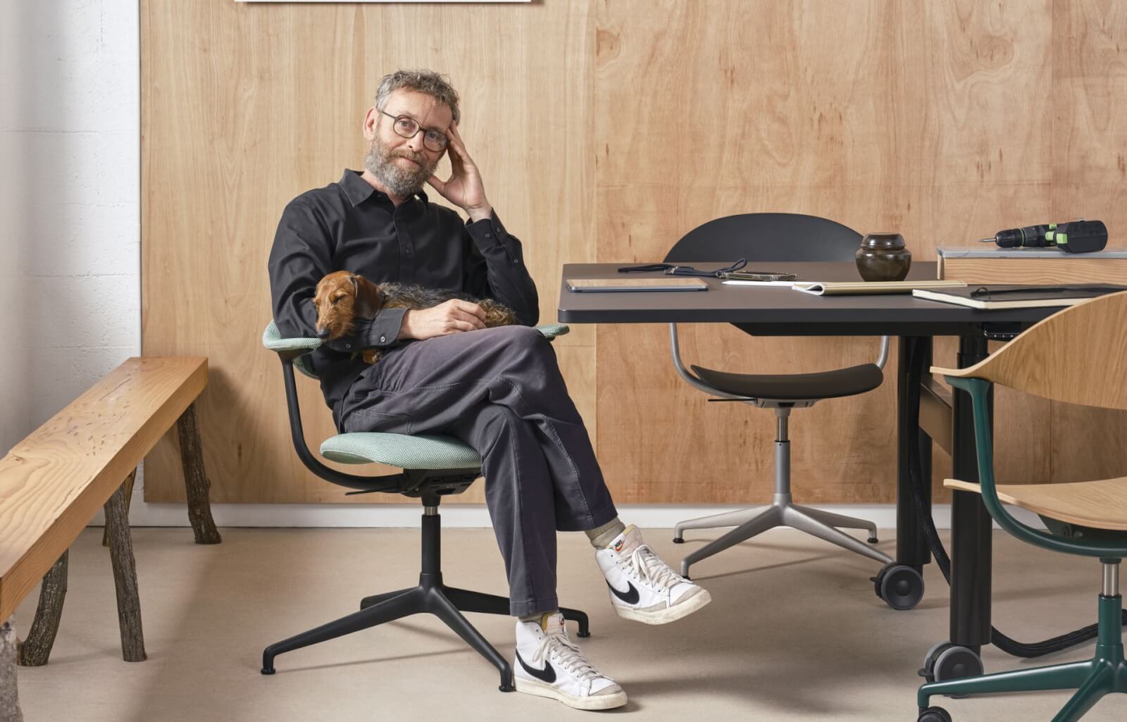 man with dog in chair