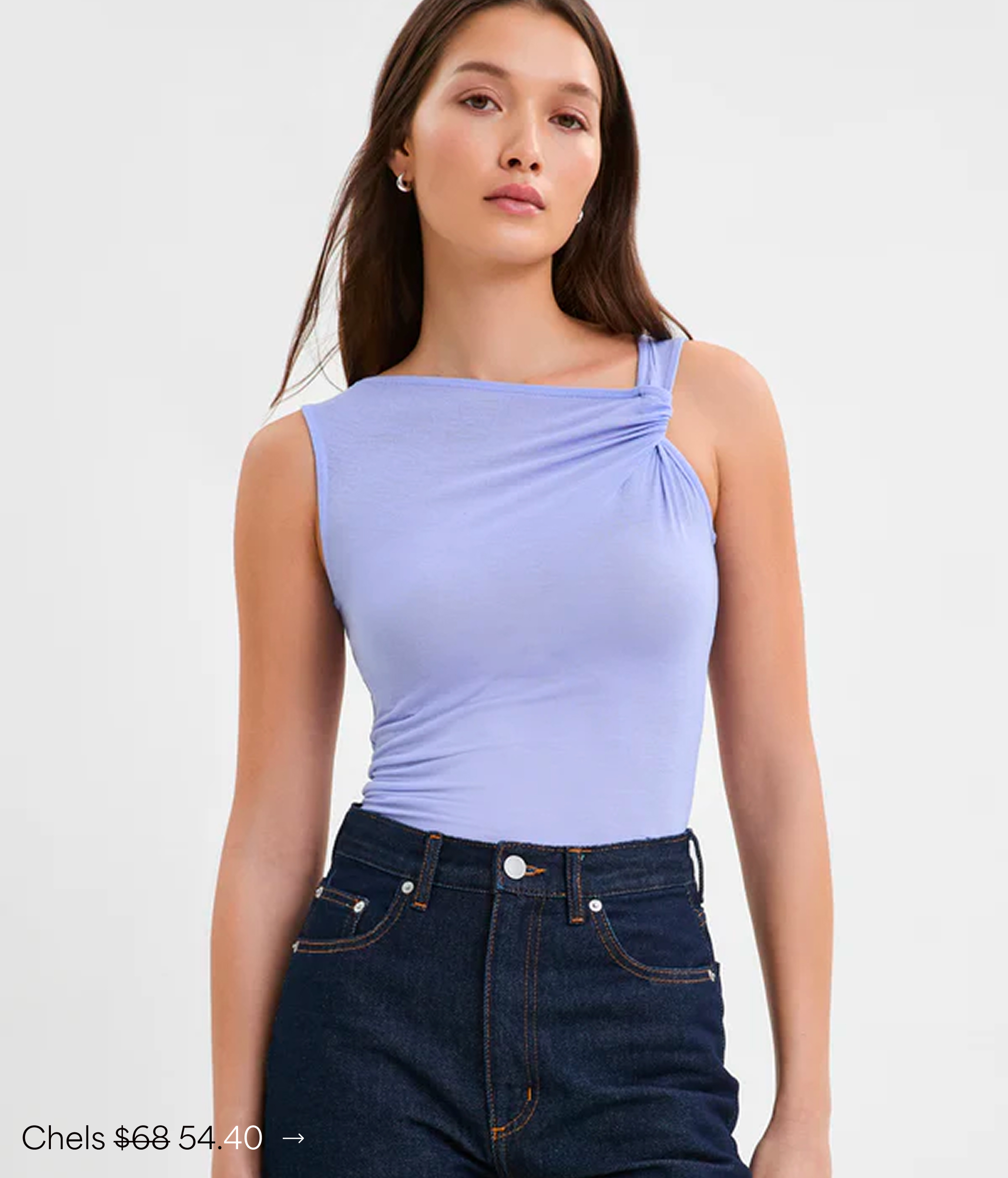 Yada in The Chels Top paired with dark jeans, labeled “Chels $54.40.”