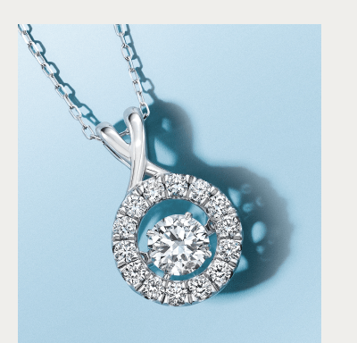 White gold necklace with round diamond pendant.