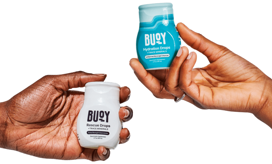 Hands holding a bottle of Rescue Drops and Hydration Drops.