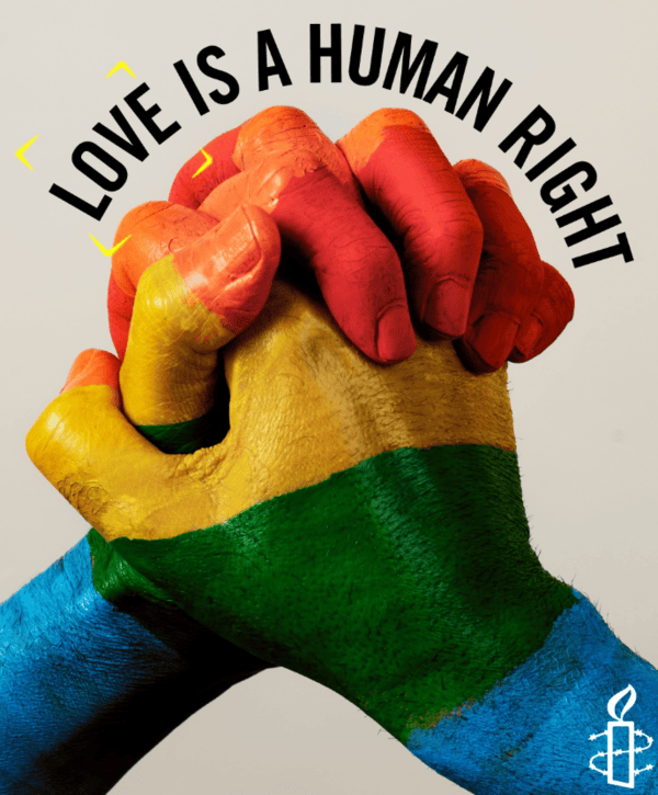 Two hands painted with rainbow stripes clasped together with headline that reads, 