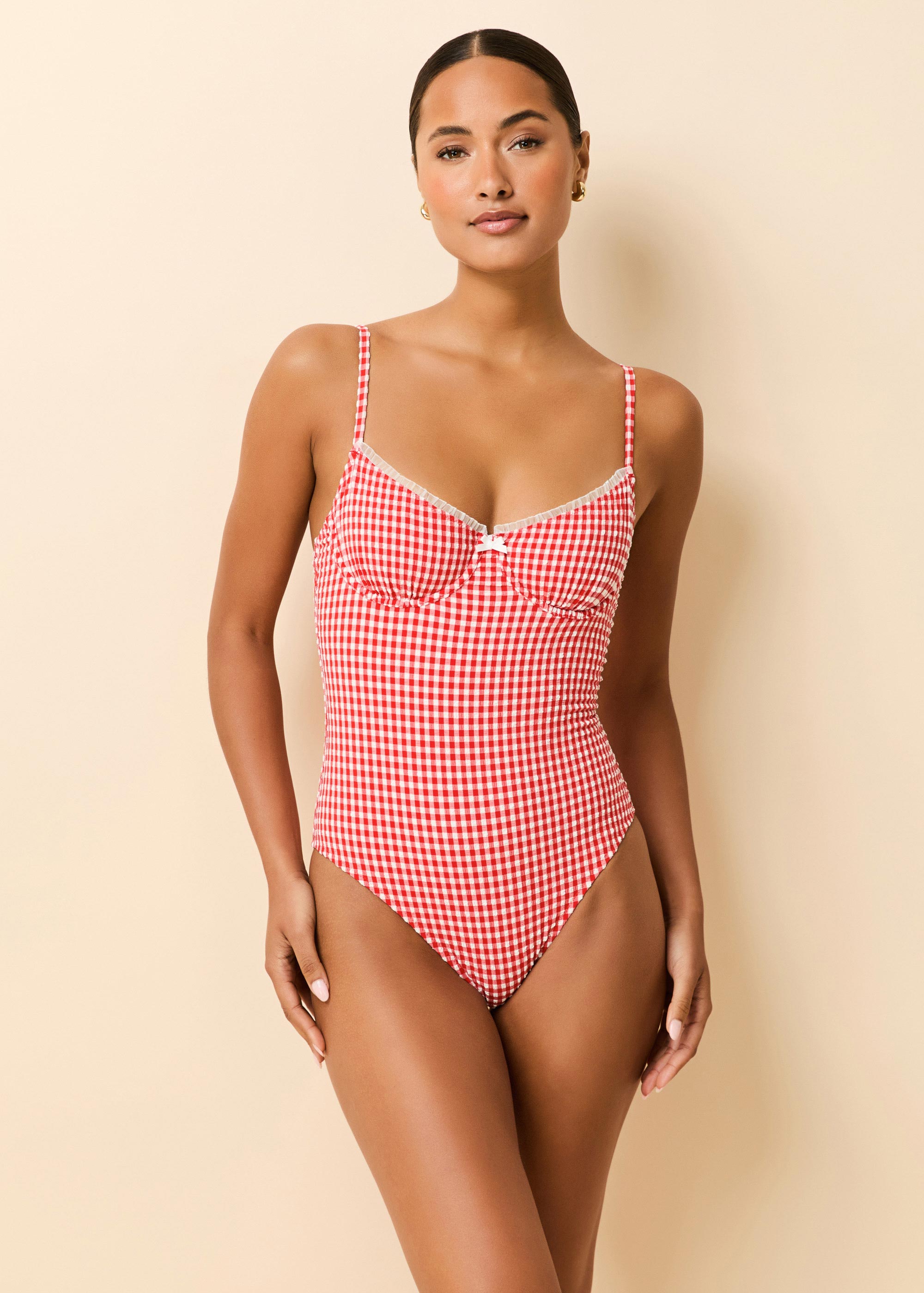 Woman in red gingham one piece swimsuit
