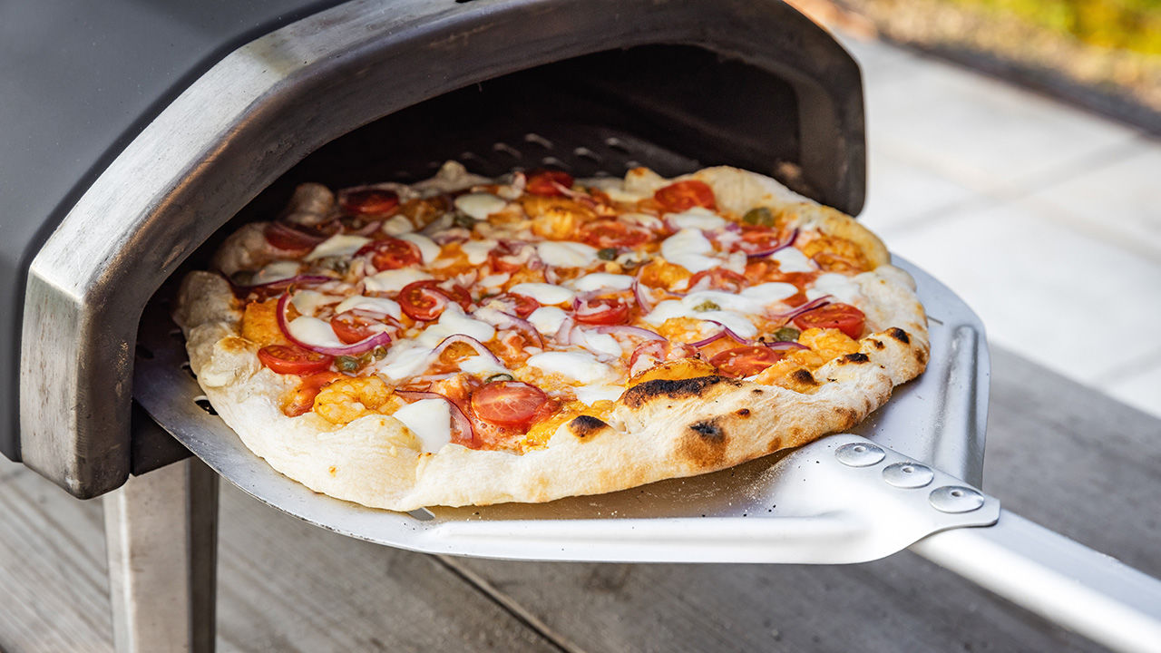 Pizza taken out of a portable oven