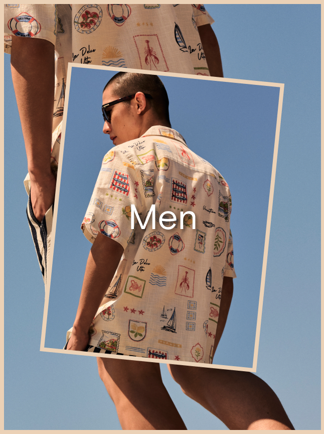 Man wearing a printed shirt with sunglasses.