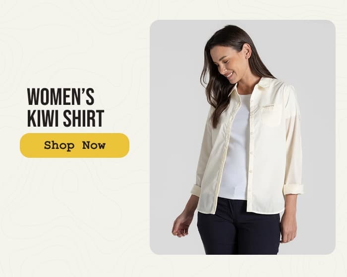 Studio photo of a woman wearing a Kiwi Shirt: Shop Now