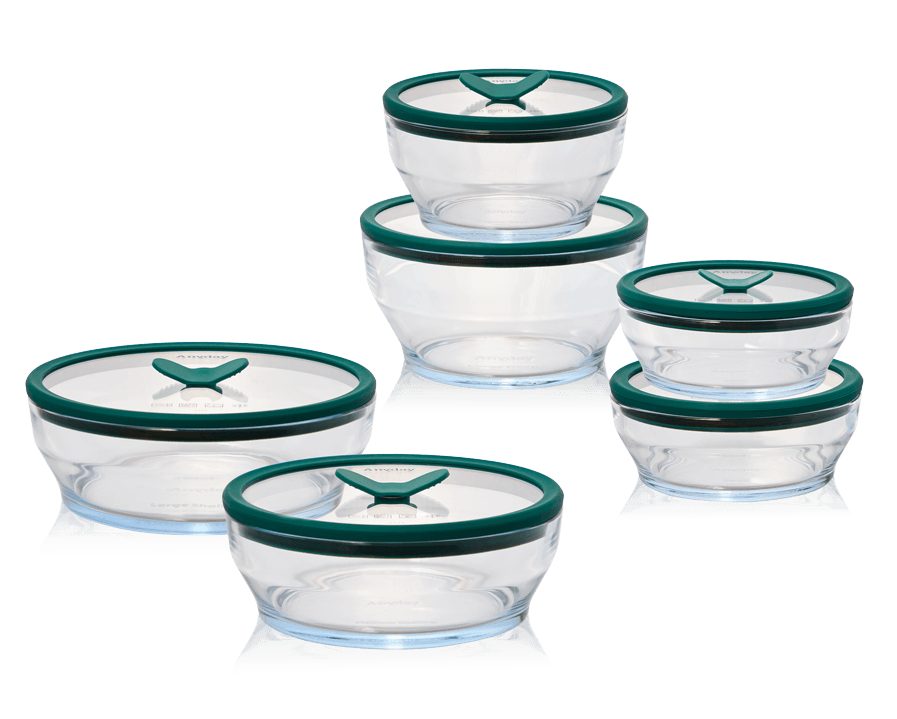 The Anyday Everything Dish Essentials Set, a plastic-free glass storage and cooking set with kale-green lids. This versatile set includes a range of sizes for meal prep, leftovers, and microwave cooking, designed for airtight and stackable storage.