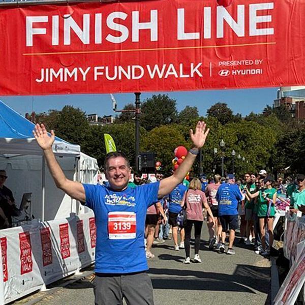 Dr. Howard Heller crossing the finish line at the Jimmy Fund Walk last fall.