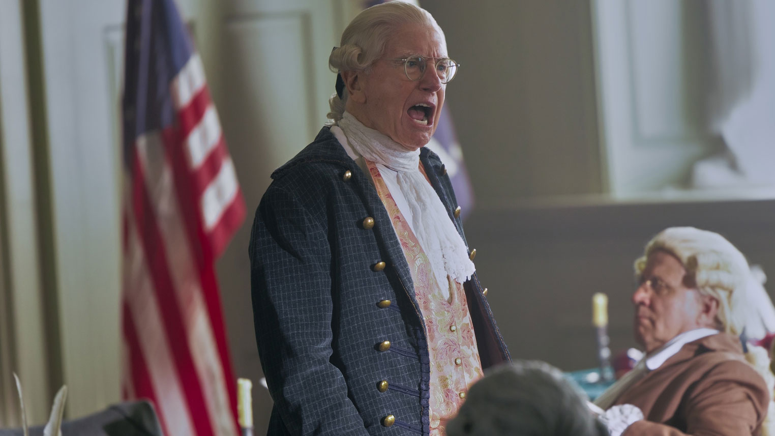 A man in a founding father costume.