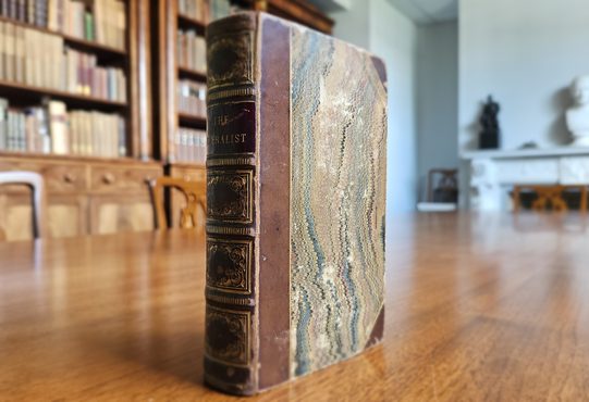 Federalist book standing upright.