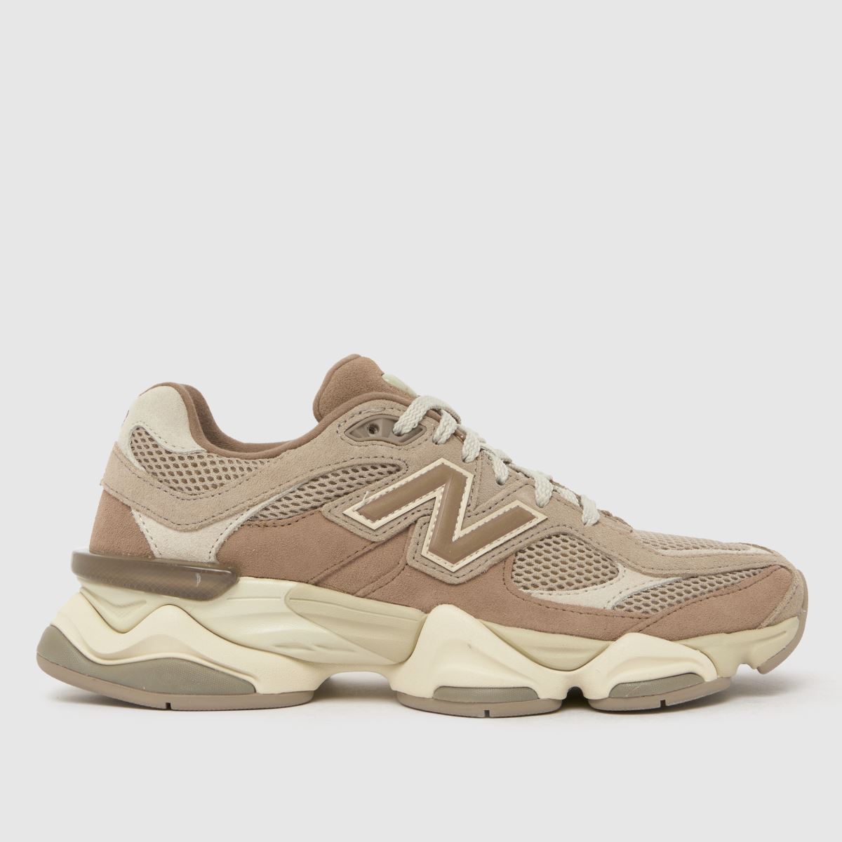 An image of a brown New Balance trainer