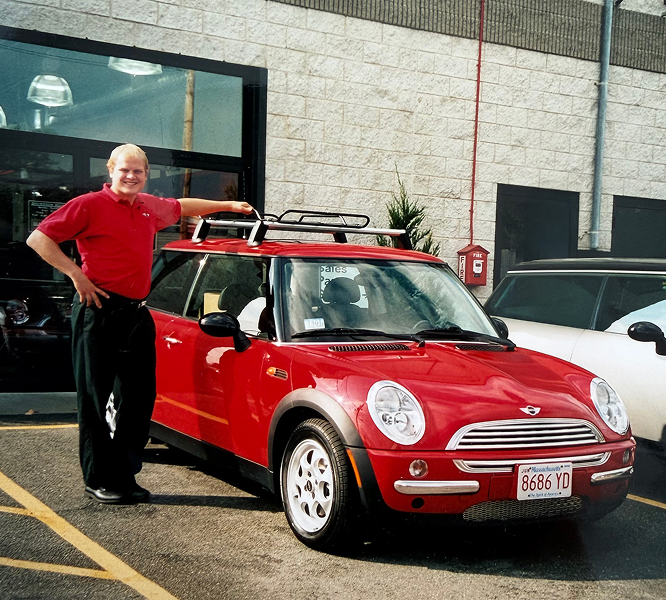 Brig Currie next to a red MINI