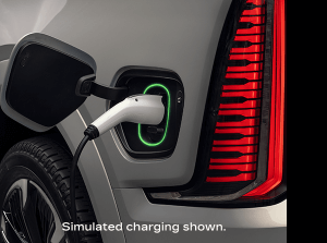 Charger plugged into vehicle with disclaimer “Simulated charging shown.”