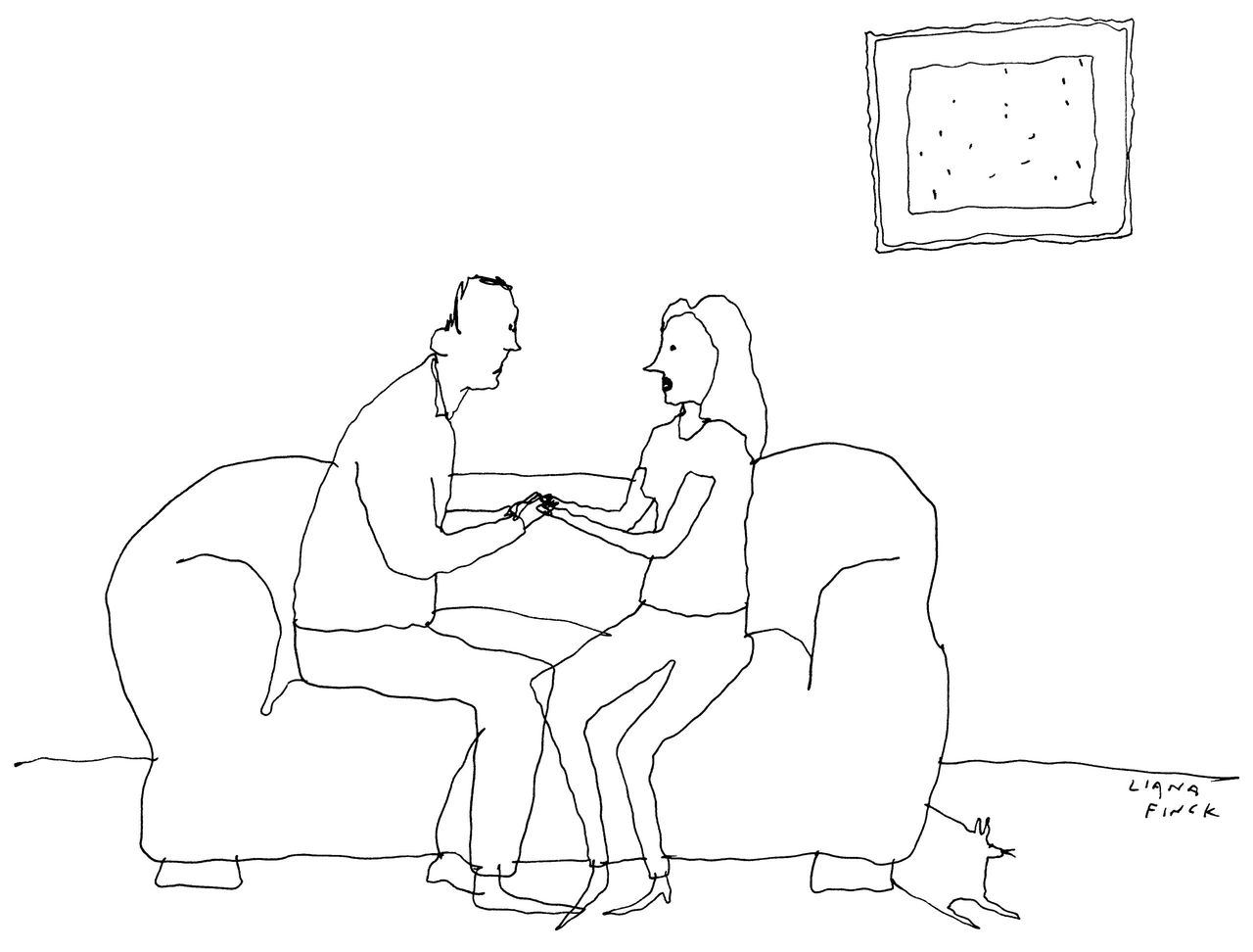 Two people sitting on a couch