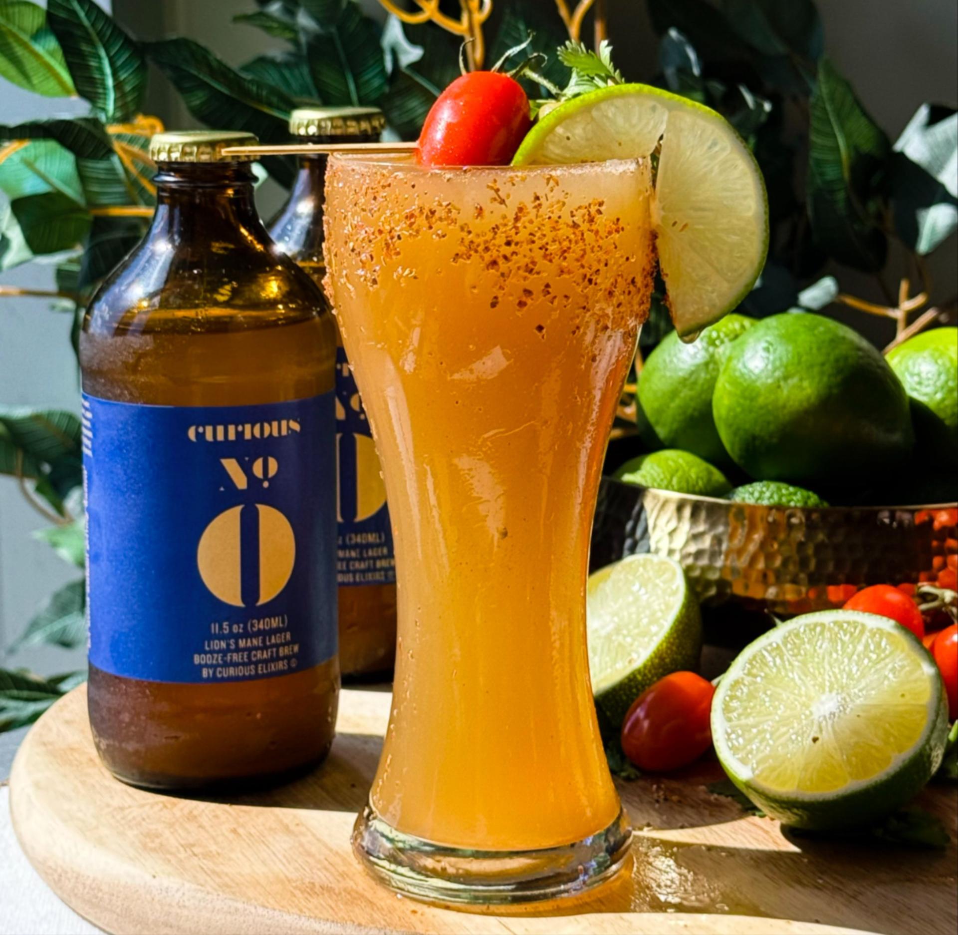 a michelada made with Curious Zero and garnishes with a pepper and a lime slice