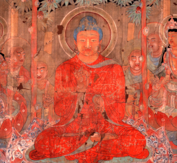 The Buddha seated surrounded by figures.
