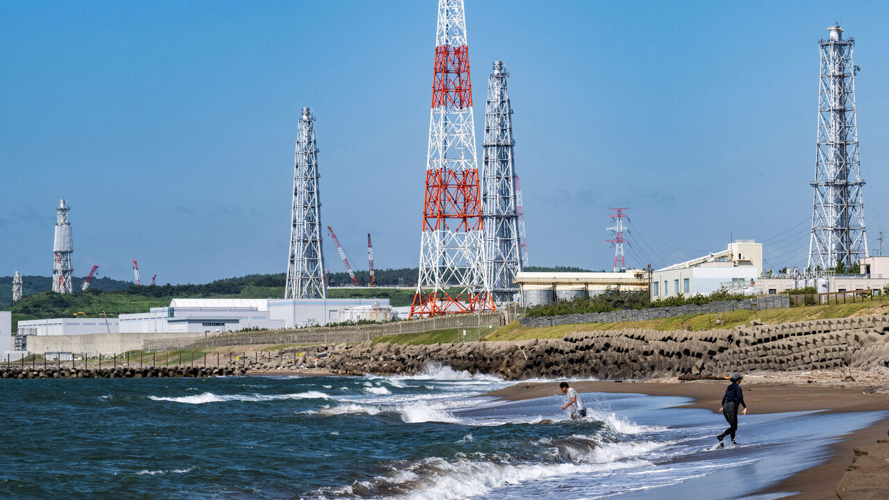 People visiting Arahama beach in front of the Kashiwazaki-Kariwa nuclear power station in Kashiwazaki, August 5, 2024 