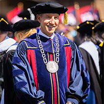 J. Larry Jameson wearing the President's badge at Commencement.