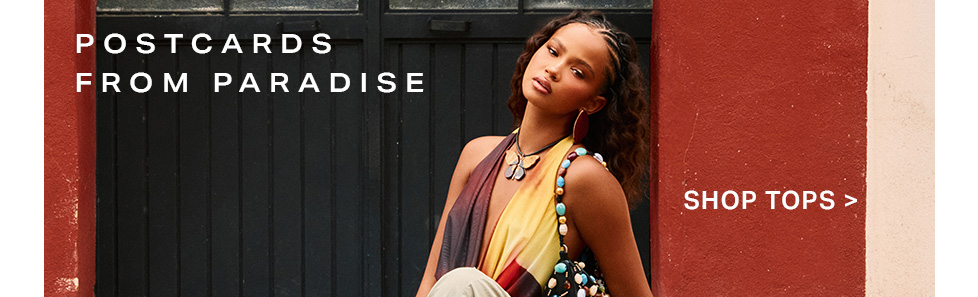 Stylish woman in a vivid gradient halter top, featuring a butterfly necklace. Promoting the new 'Postcards from Paradise' fashion tops collection.
