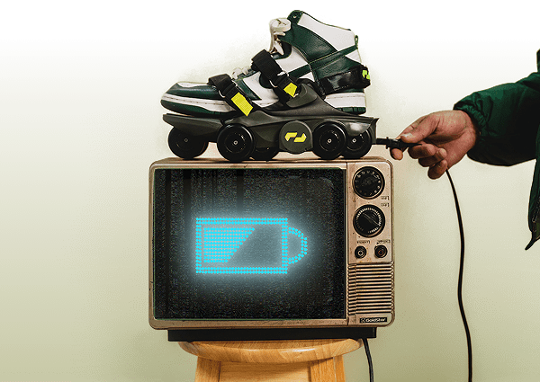 Shift Robotics Moonwalkers charging on a vintage TV displaying a battery icon.