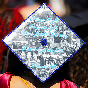A graduation cap with a Bible verse and a collage of photos on it.
