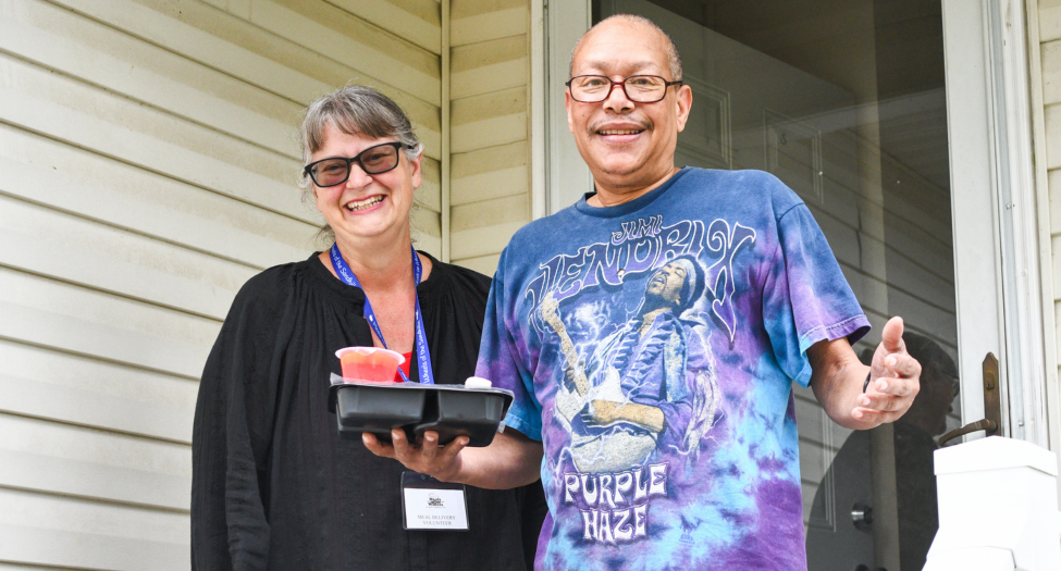 Image of Meals on Wheels volunteer with client, Rodney.