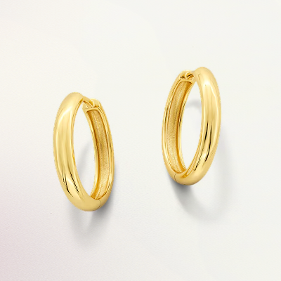 A pair of gold hoop earrings.