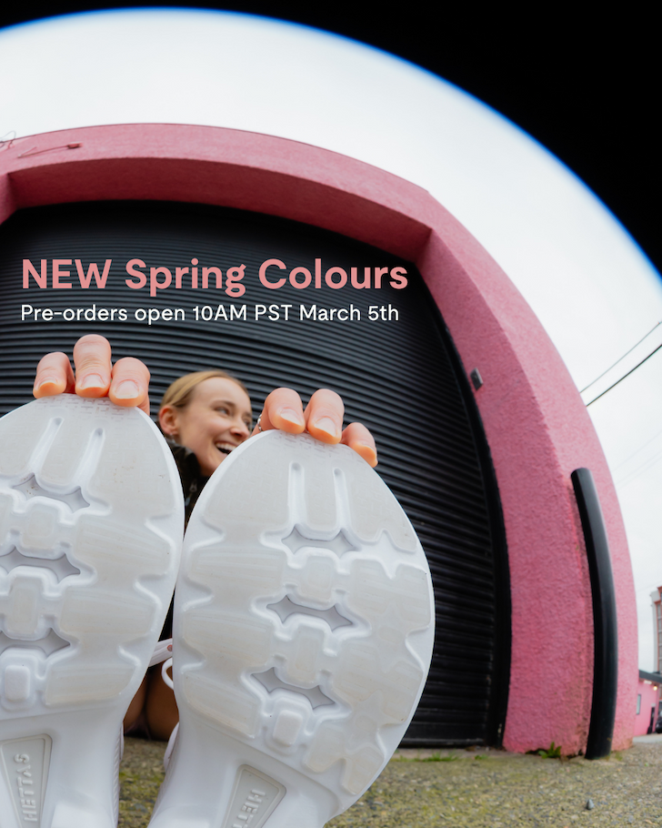 an image of a woman is holding up a pair of white shoes