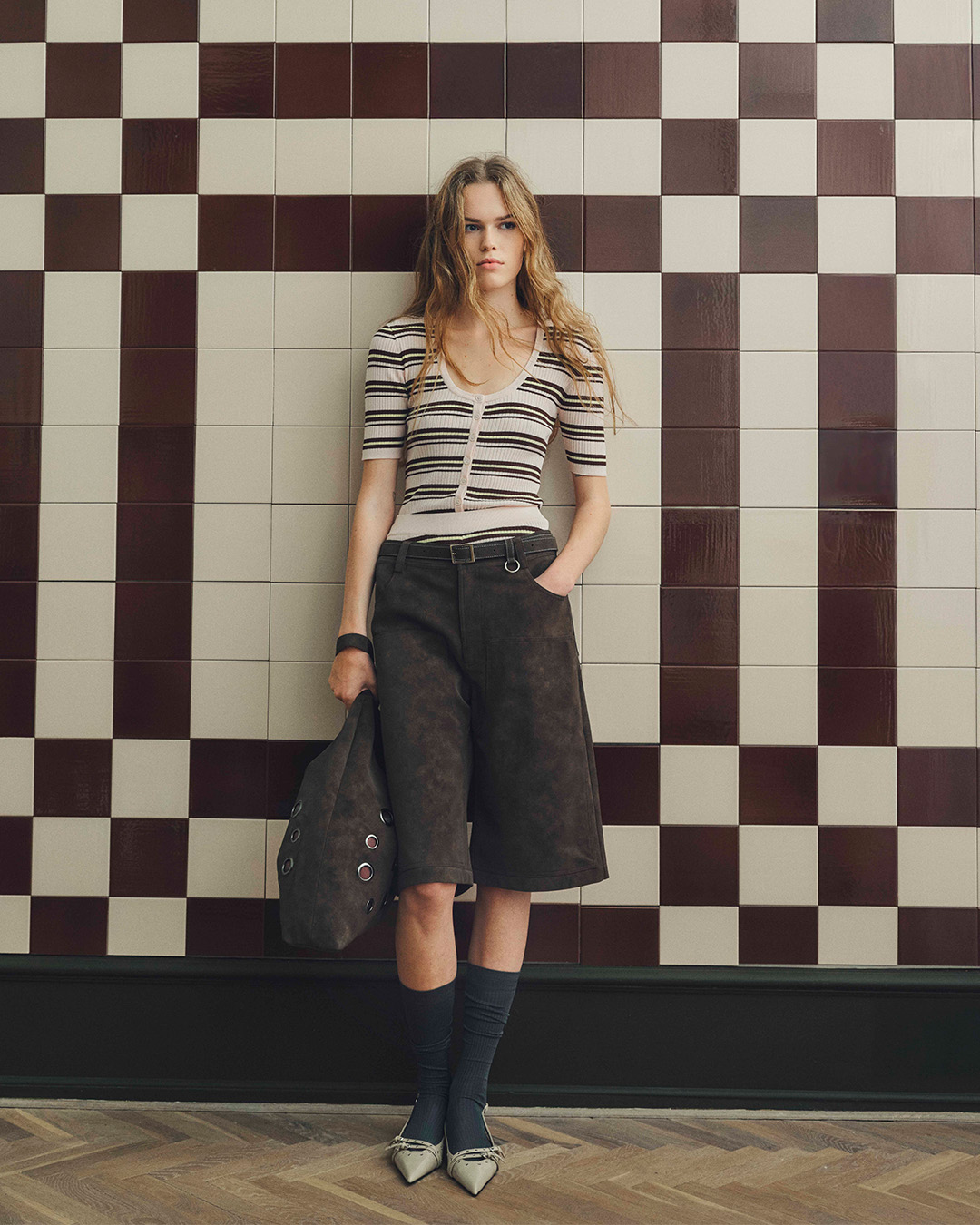 Girl in checked skirt and denim jacket