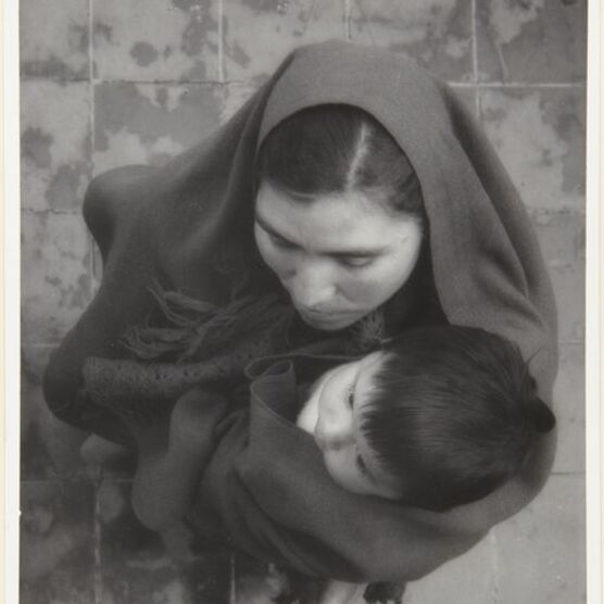 black and white photo of mother and child from above