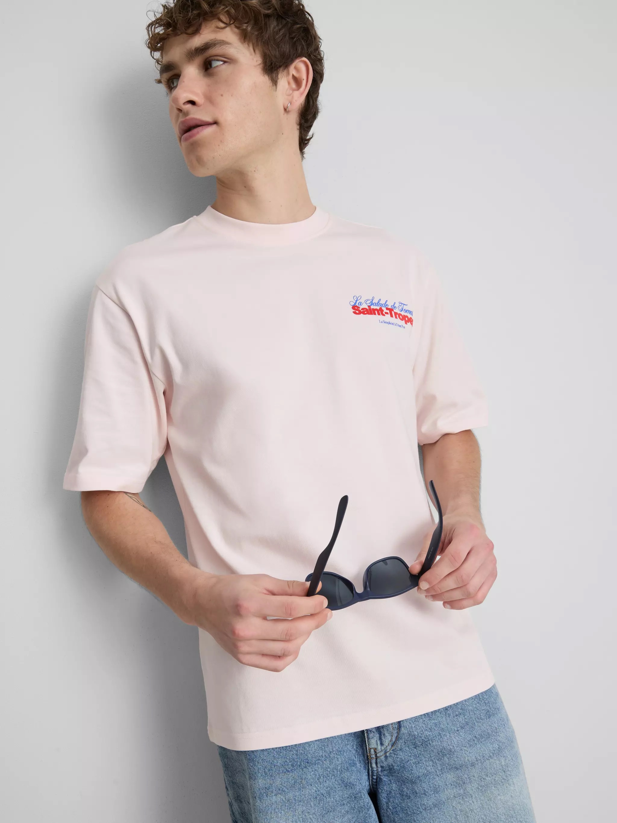 Man wearing a Saint-Tropez Graphic T-Shirt