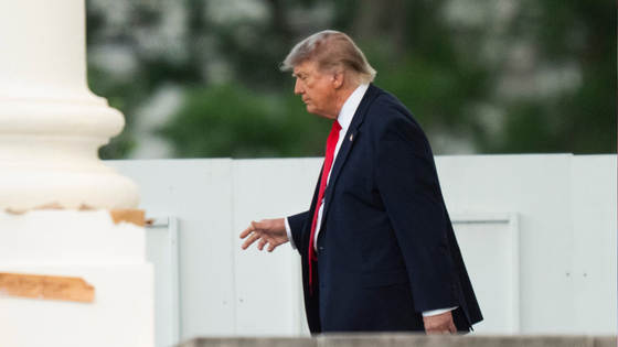 President Trump walks on the North Portico as he leaves the White House to attend the opening of the Great American State Fair. 