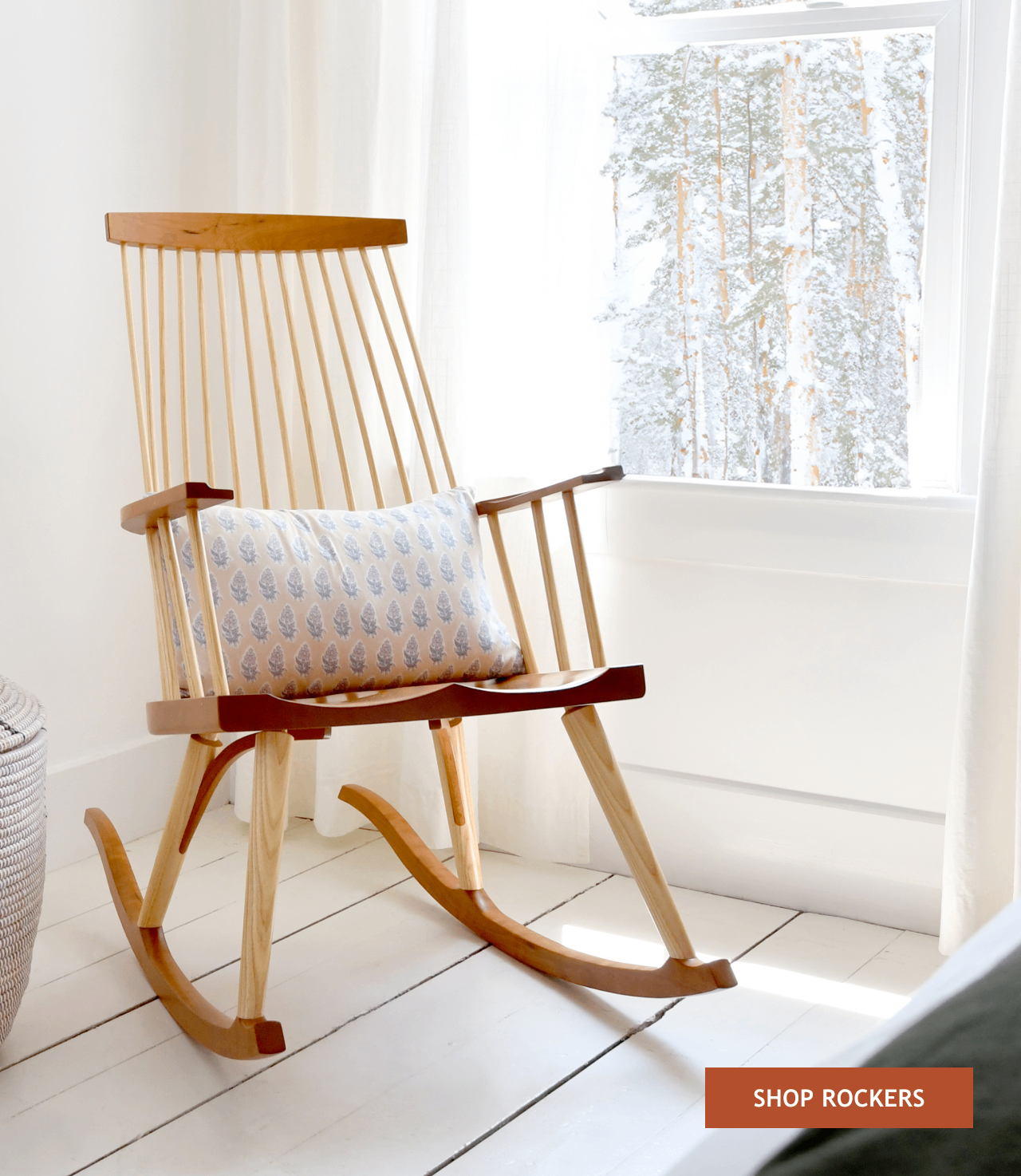 New Gloucester Rocker beside a snowy window.