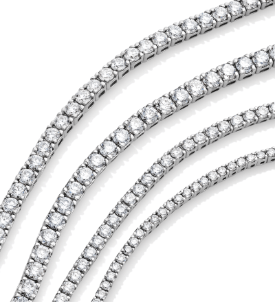 Close-up of diamond tennis bracelets in white gold.