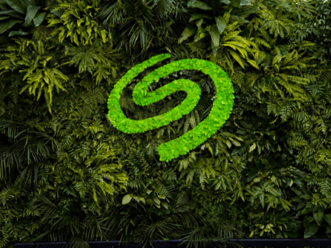 A vibrant green Seagate logo set against a backdrop of dense green foliage, emphasizing a connection to nature